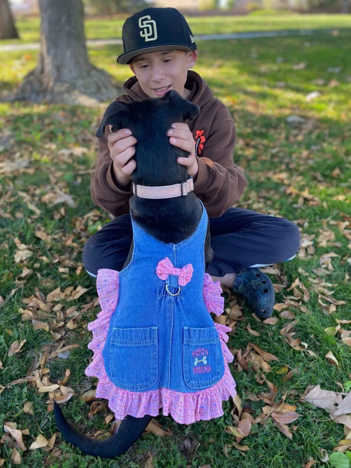 One of the kids with a foster puppy at the park.