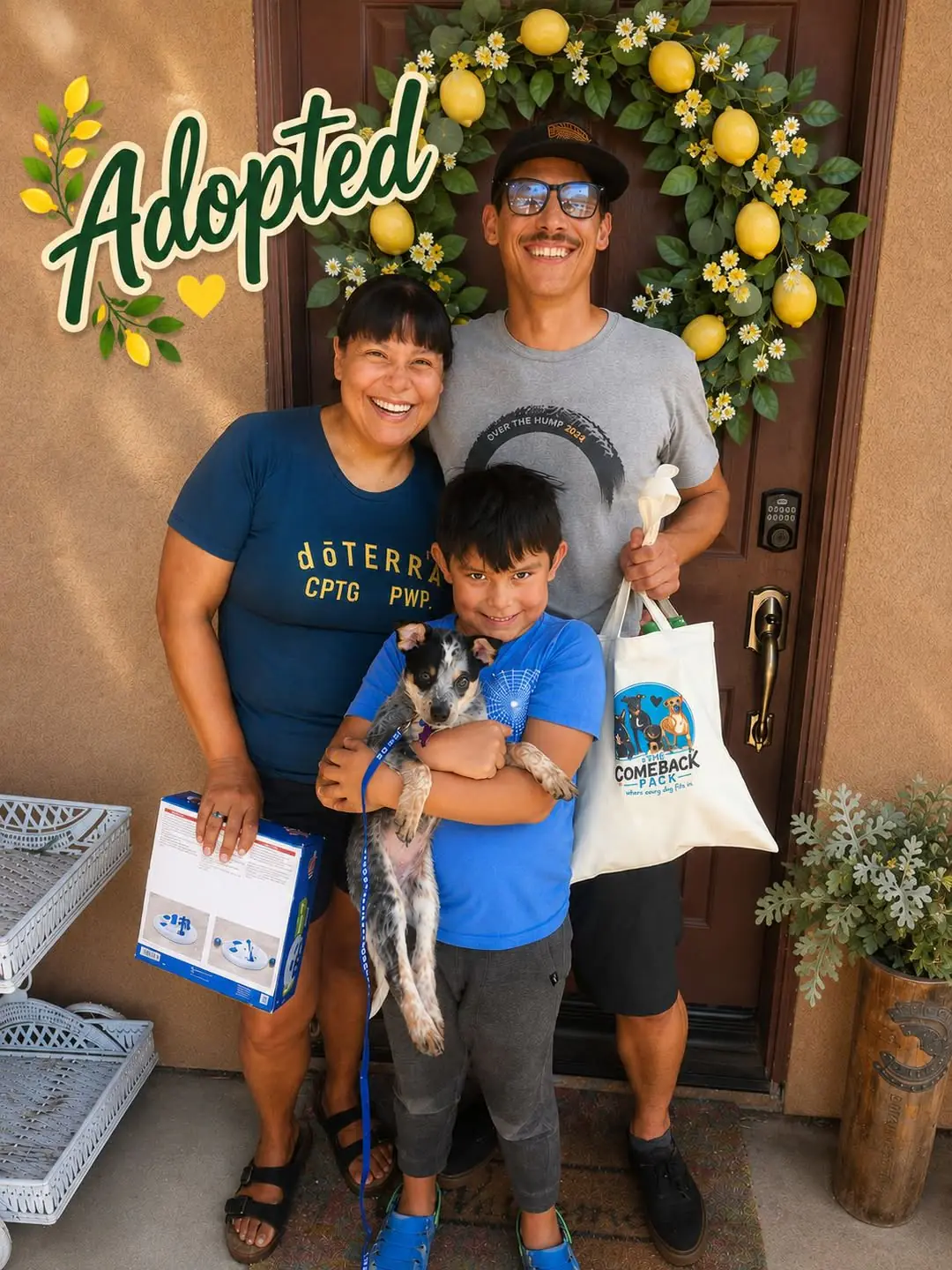 Sam's new adopters smiling together in front of their door, with their son holding Sam the Blue Heeler puppy and an "Adopted" graphic overlay